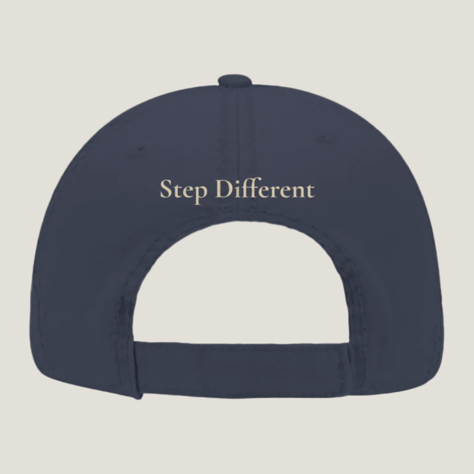 Blue distressed hat with burnt copper “Step Different” embroidery on the back.
