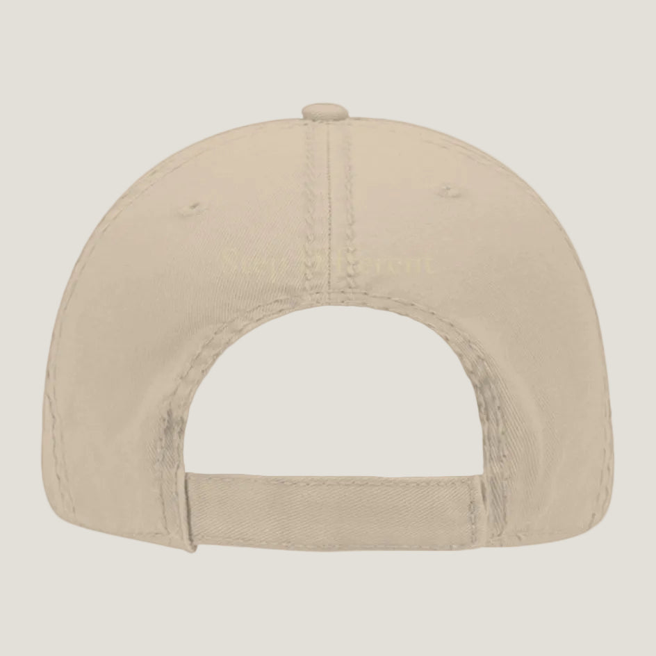 Khaki distressed hat with burnt copper “Step Different” embroidery on the back.