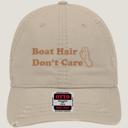 Khaki distressed hat with burnt copper “Boat Hair Don’t Care” embroidery and Long Toe Life foot logo.