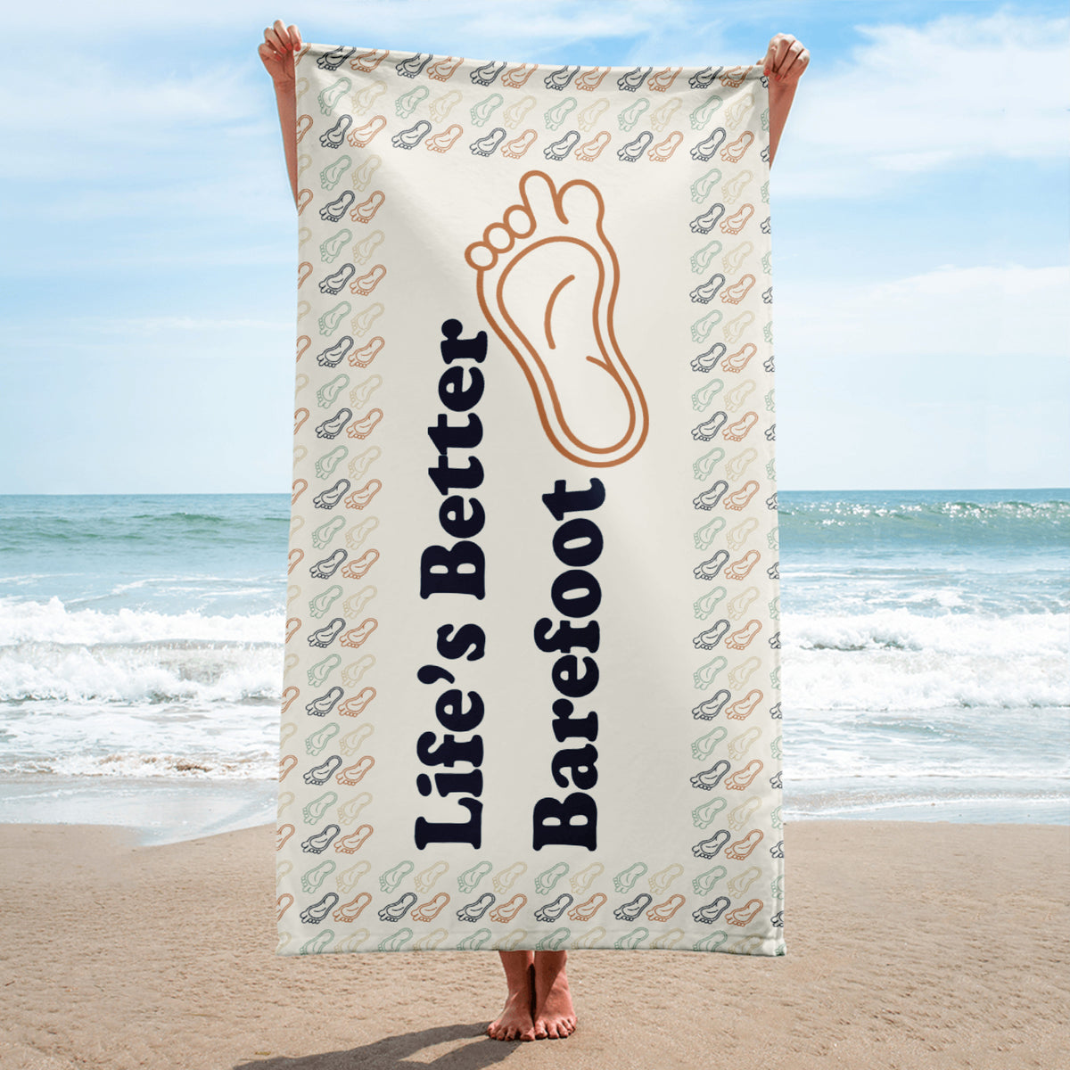 Beach Towel with "Life's Better Barefoot" a symbol of a foot with a long toe and a feet boarder.