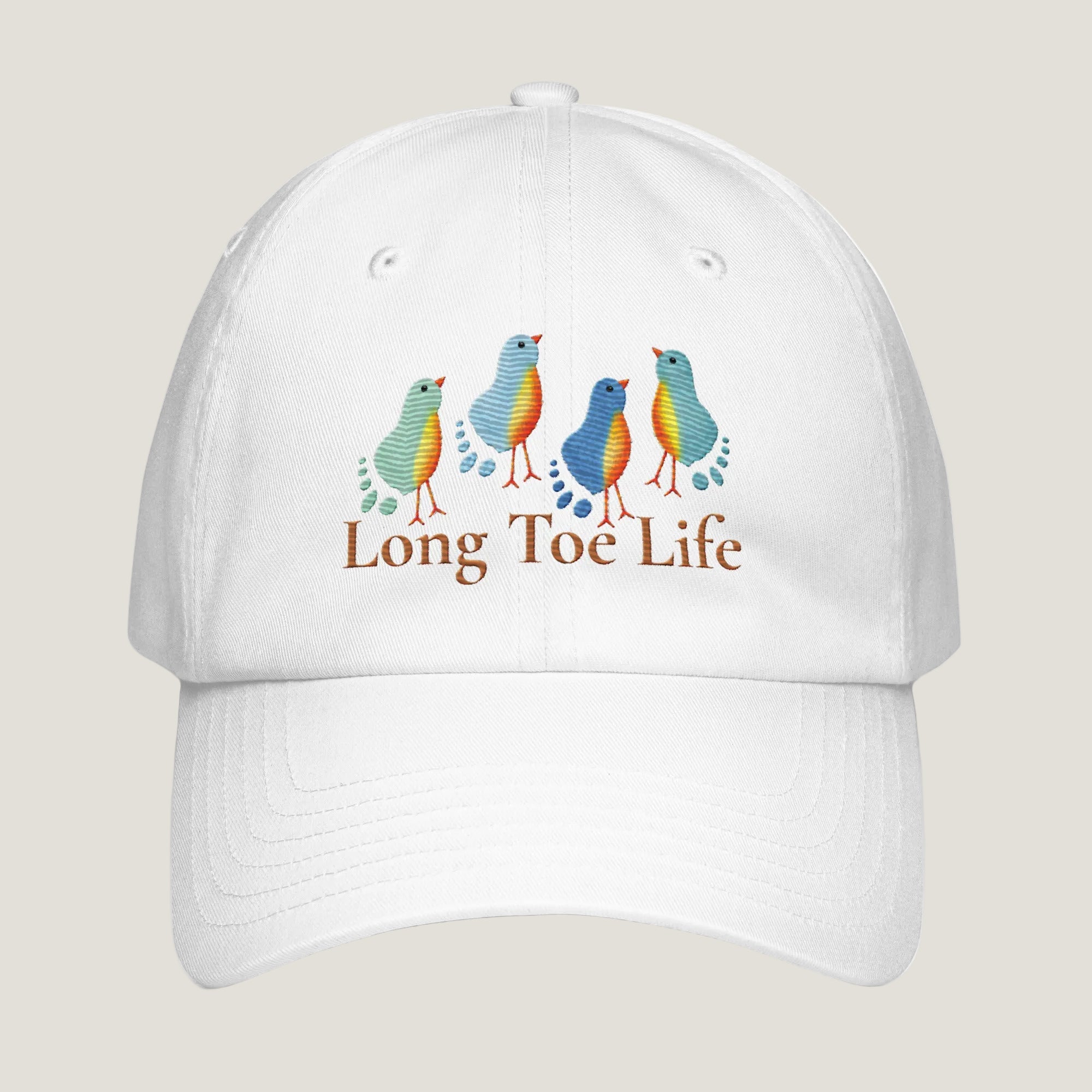 A white baseball cap featuring a graphic of four colorful birds in shades of blue, green, and orange, with the text 'Long Toe Life' printed below in brown. The cap is shown against a plain white background.