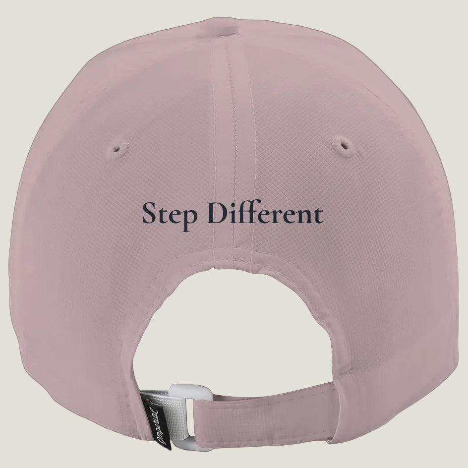 A dusty pink baseball cap shown from the back, featuring the text 'Step Different' printed in blue.